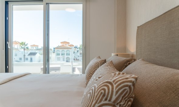 Obra nueva - Apartamento -
Playa Flamenca